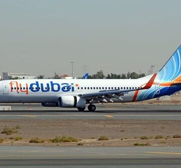 A FlyDubai Boeing 737 passenger aircraft on an airport tarmac. A FlyDubai Boeing 737 passenger aircraft on an airport tarmac.