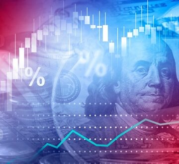 Concept graphic symbolizing financial markets, featuring a U.S. dollar bill and rising candlestick charts. Concept graphic symbolizing financial markets, featuring a U.S. dollar bill and rising candlestick charts.