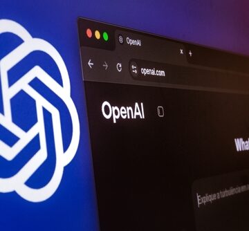 The OpenAI logo alongside a computer screen displaying the ChatGPT and OpenAI website. The OpenAI logo alongside a computer screen displaying the ChatGPT and OpenAI website.