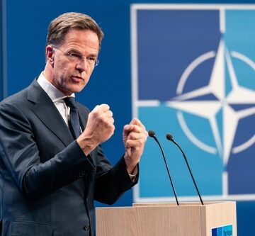 NATO Secretary General Mark Rutte speaking and gesturing at a press conference.