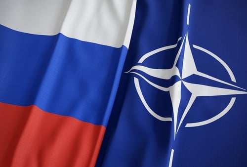 The national flag of Russia alongside the flag of the North Atlantic Treaty Organization (NATO). The national flag of Russia alongside the flag of the North Atlantic Treaty Organization (NATO).