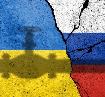 A split and cracked background with the blue-and-yellow flag of Ukraine on the left and the white-blue-and-red flag of Russia on the right, overlaid with a pipeline silhouette.